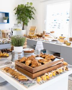 a buffet with a variety of pastries and other desserts at Hotel Majorca in Gabicce Mare