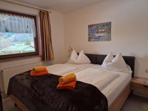 Postel nebo postele na pokoji v ubytování Appartementhaus Hüttenberger