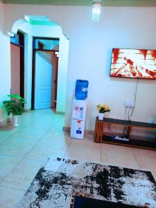 a room with a hallway with a door and a table at Bamburi 2 bedroom Luxury homes in Bamburi