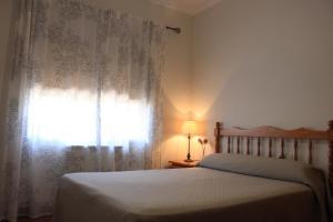 Postel nebo postele na pokoji v ubytování Albergue Los Chorros