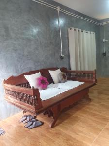 Postel nebo postele na pokoji v ubytování Mind's Homestay มายด์โฮมสเตย์