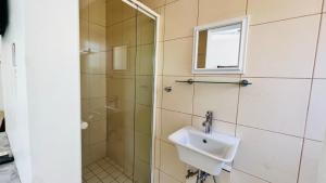 a bathroom with a sink and a shower at Casablanca Guest House in Durban