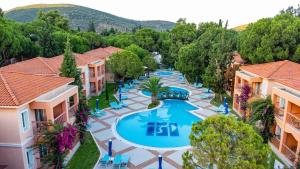 an overhead view of a swimming pool at a resort at Kustur Club Holiday Village - All Inclusive in Kuşadası