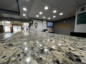 a lobby with a large marble counter top at Quality Inn & Suites in Hinton