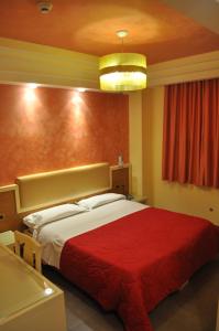 Postel nebo postele na pokoji v ubytování Aerhotel Phelipe