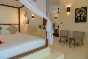 Postel nebo postele na pokoji v ubytování Alma Boutique Hotel