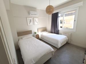 Ένα ή περισσότερα κρεβάτια σε δωμάτιο στο Two Bedroom Condo - Just Renovated Great Location