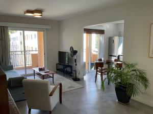 a living room with a couch and a table at Two Bedroom Condo - Just Renovated Great Location in Nicosia