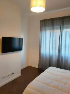 TV a/nebo společenská místnost v ubytování Il covo dei Briganti + 7 fotografií