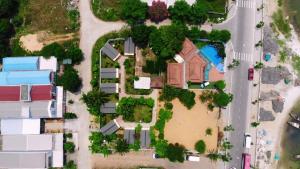an overhead view of a house with trees and bushes at B&H Villa - Villa has swimming pool in Lang Co