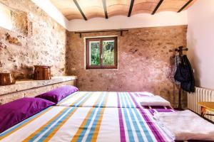 a bedroom with a bed and a window at Finca Relax Can Mengol amazing seaview in Artá +42 photos