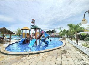 a large water park with a slide and slides at BnB House Villa Jogja in Yogyakarta