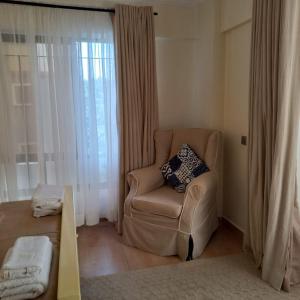 Postel nebo postele na pokoji v ubytování POPSY HOMES NAKURU CBD