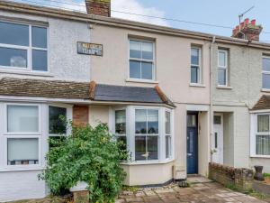 an old house with a sign on the front of it at 2 Bed in Rye 86094 in Rye