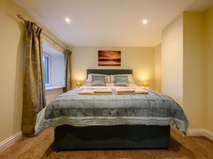 Ένα ή περισσότερα κρεβάτια σε δωμάτιο στο 3 Bed in Keswick 86867