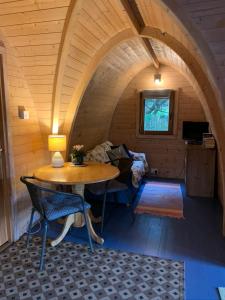 a room with a table and chairs and a couch at Silverspring Hideaways in Constantine