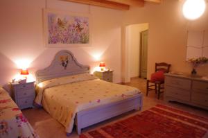 Posteľ alebo postele v izbe v ubytovaní Agriturismo La Casa Del Mandorlo