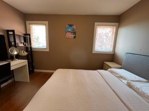 Postel nebo postele na pokoji v ubytování Comfortable Utopia B&B