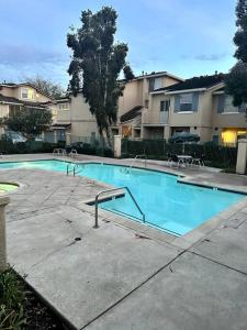 a large swimming pool in a apartment complex at Bohemian Bliss 10 Min from DT SJ in San Jose