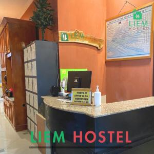 a restaurant with a desk with a computer on it at Liem Hostel Malioboro in Sentool