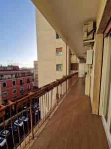 a balcony of a building with a view of a city at Ciao Napoli in Naples