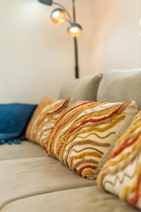 two pillows sitting on top of a couch at Villa Kara Mia BY APOKORONAS-VILLAS in Kókkinon Khoríon