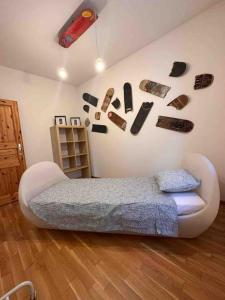 a bedroom with a bed and a wall with magnets at Rancate charme apartment in Mendrisio