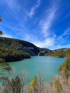 a large lake in the middle of a mountain at LA COLMENA in Cañizares +20 photos