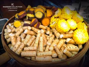 a basket full of different types of vegetables at Radisson Collection Hyland Shanghai in Shanghai