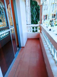 a hallway of a building with a red tile floor at Bamburi 2 bedroom Luxury homes in Bamburi