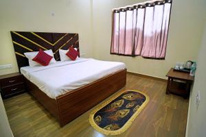 Hotel SD Grand Palace tesisinde bir odada yatak veya yataklar