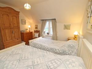 a bedroom with two beds and a window at 3 Bed in Whitley Bay CN013 in Backworth