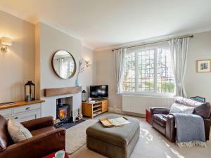 a living room with a couch and a fireplace at 2 Bed in Harrogate 74981 in Harrogate