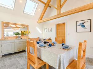 a dining room with a table and chairs at 2 Bed in Stourhead 66326 in Kilmington