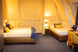 Postel nebo postele na pokoji v ubytování Hotel de Gulden Leeuw