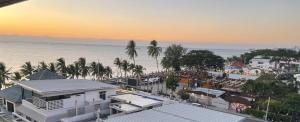 an aerial view of a city with the ocean at Sugar Beach Bangsaen in Ban Bang Saen (1)