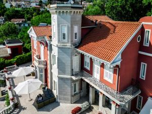 an aerial view of a building with a lighthouse at Villa Bottacin in Trieste