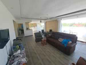 a living room with a couch and a table at Diamond Sands Villa in Ukunda