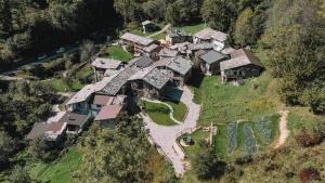 an aerial view of a house on a hill at L'Escola e Lou Mulin in Sampeyre