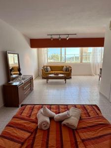 a room with a bed and towels on the floor at Summer Villa , Kaki Thalassa in Dhaskalión +30 photos