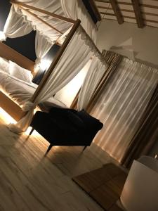 a bedroom with a bed with a canopy at Villa White Luxury Residence in Marsala