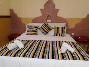Postel nebo postele na pokoji v ubytování Hotel Riad Oasis