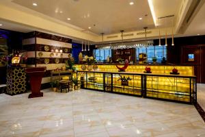 a lobby with a bar in a building at Quiet Hotel Al Shatee in Jeddah