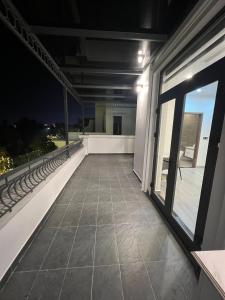 a balcony with a view of the night at Vinhomes Marina in Xóm Niêm