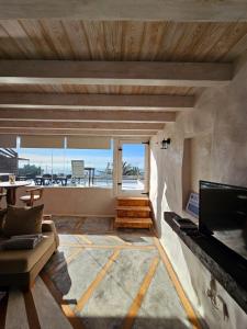 a living room with a view of the ocean at Casa Yuno en La Asomada in La Asomada