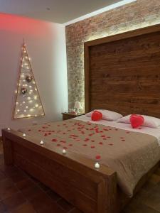 a bedroom with a bed with a christmas tree at “La Casetta nel Borgo” in Cerveteri
