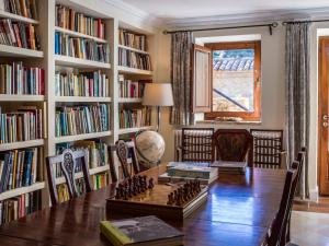 a room with a table with a chess board on it at La Torre del Visco - Relais & Châteaux in Fuentespalda