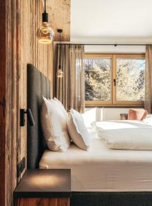 Postel nebo postele na pokoji v ubytování Hotel Piz Seteur