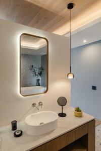 a bathroom with a sink and a mirror at Clouds Estate in Stellenbosch