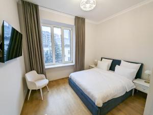 Postel nebo postele na pokoji v ubytování Kyiv Honchara Hotel